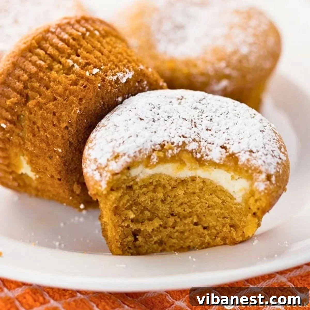 Spiced Pumpkin Cream Cheese Swirl Muffins 2 Delicious homemade pumpkin cream cheese muffins, a perfect fall treat.
