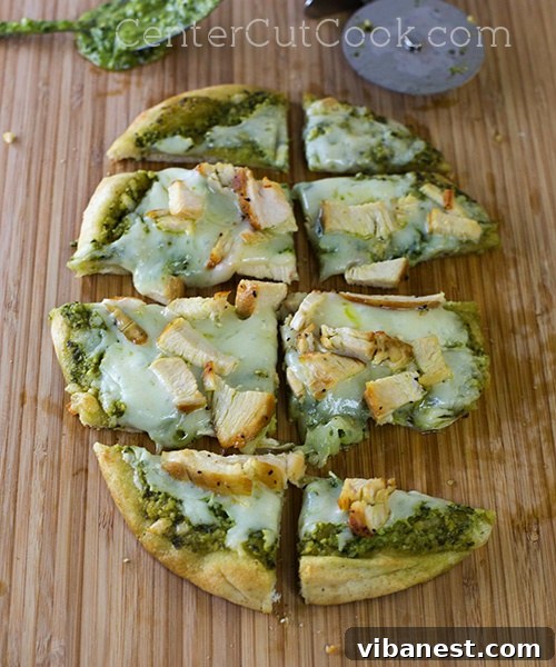 Baked Chicken & Pesto Flatbreads Freshly baked Chicken Pesto Flatbreads with melted cheese, just out of the oven