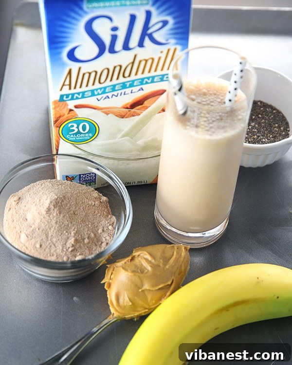 Creamy Chocolate Peanut Butter Smoothie - Ready to Enjoy A close-up shot of a creamy chocolate peanut butter smoothie in a glass, with a view of its rich, thick texture, ready for consumption