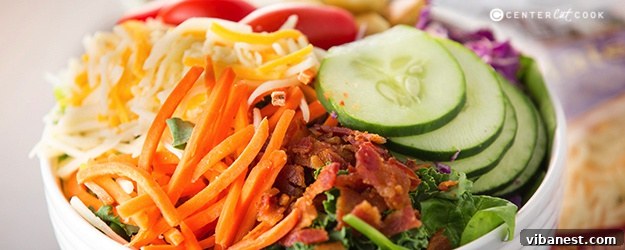 Ultimate summer salad featuring fresh greens, vibrant vegetables, crispy bacon, and Sargento cheddar cheese