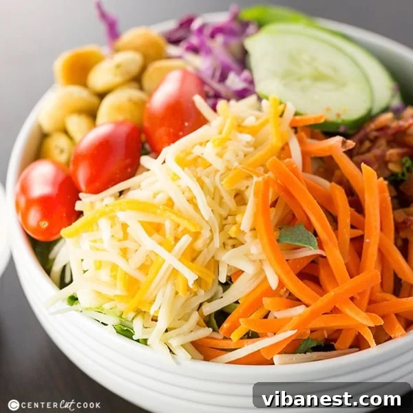 Ultimate Summer Salad Recipe Close-up of Ultimate Summer Salad showcasing colorful ingredients and a generous drizzle of homemade dressing