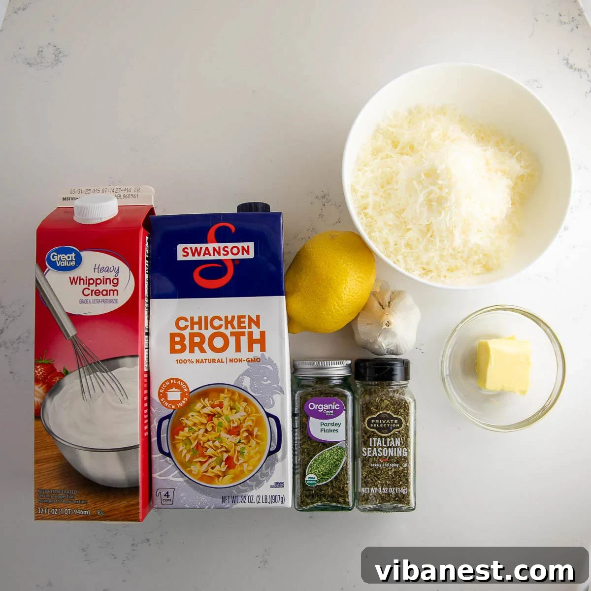 Lemon Garlic Shrimp Linguine 4 A vibrant spread of fresh ingredients for shrimp scampi pasta, including raw shrimp, garlic, lemon, pasta, and herbs, ready for cooking.