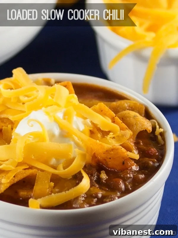 Slow cooker chili cooking. Close-up shot of slow cooker chili simmering, showing texture and rich color.
