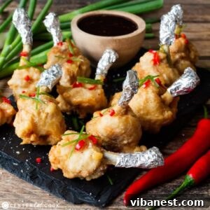 plate of chicken lollipops with dipping sauce