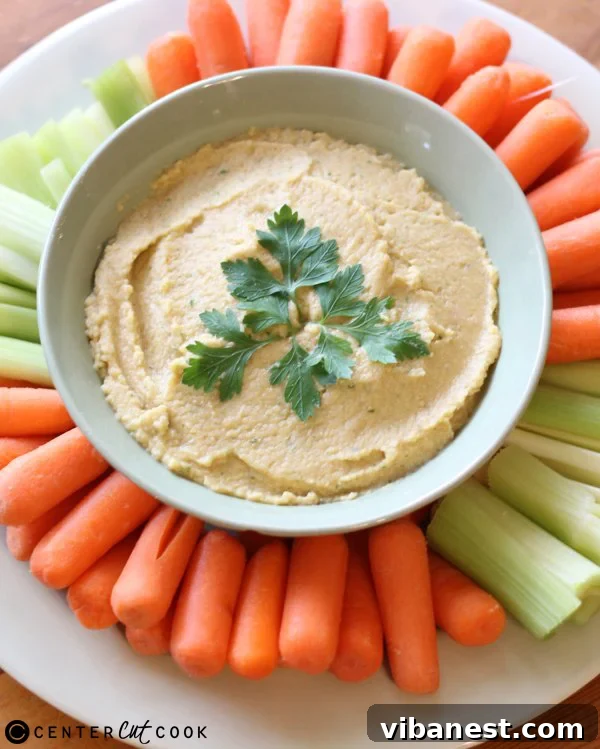 homemade-hummus-3.jpg Homemade Hummus Garnished with Fresh Parsley and Olive Oil