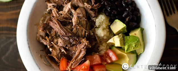 Delicious Slow Cooker Carnitas Burrito Bowl with fresh toppings