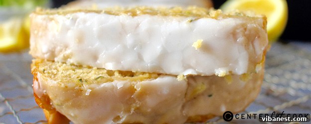 lemon-zucchini-bread-1.jpg A close-up shot of the perfectly golden crust of lemon zucchini bread, showing its moist texture and the delicate shimmer of the lemon glaze.