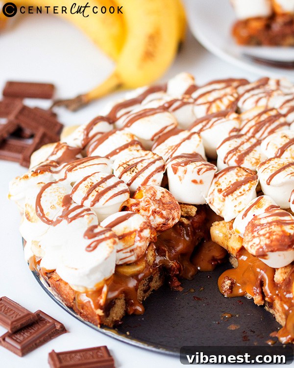 Banoffee S'mores Pizza Texture Close-up of Banoffee S'mores Pizza showing melted chocolate and golden marshmallows