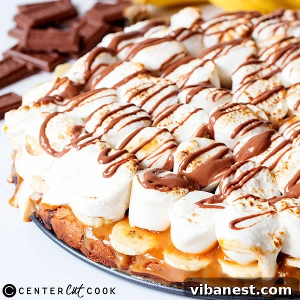 Banoffee S'mores Pizza Final Product Finished Banoffee S'mores Pizza, showcasing toasted marshmallows and chocolate swirls