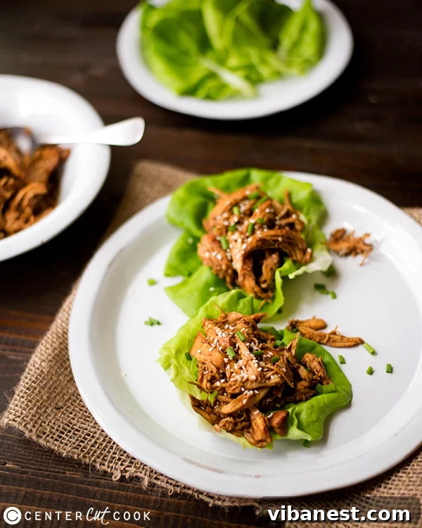 Slow Cooker Sesame Chicken Wraps, close up of shredded chicken