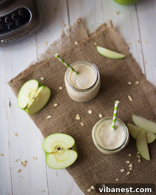 Apple Pie Smoothie Detail Close-up of a glass of apple pie smoothie, garnished with cinnamon.