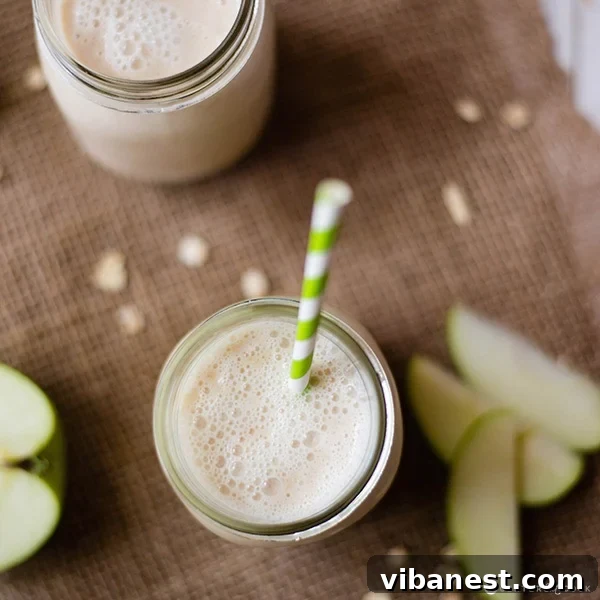 Healthy Apple Pie Smoothie Recipe Garnished apple pie smoothie in a glass.