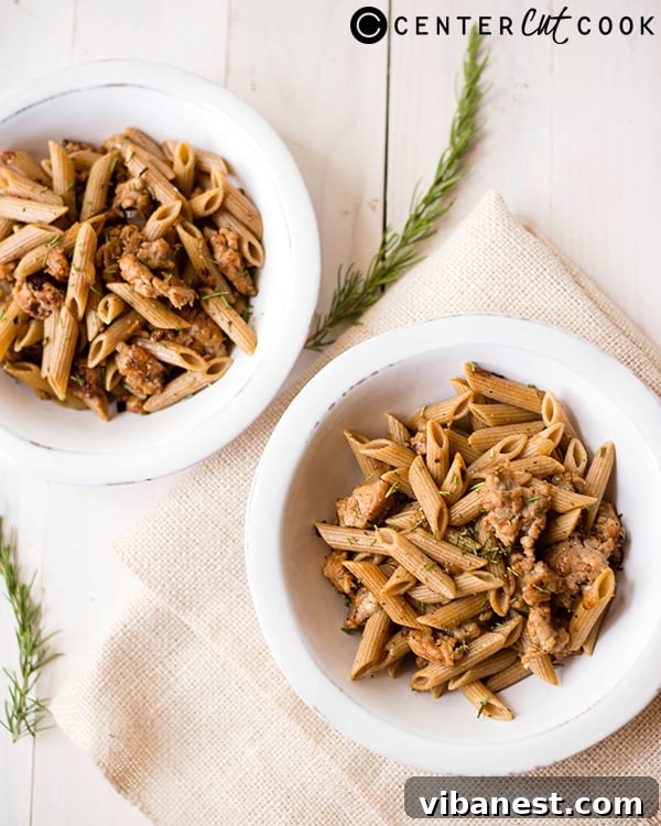 Healthy Pasta Ingredients Assortment of fresh ingredients for healthy chicken sausage pasta on a wooden surface