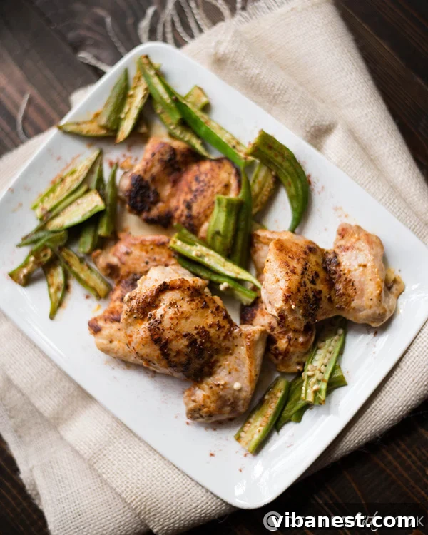 Roasted chicken and okra presented beautifully on a plate, highlighting the delicious colors and textures.