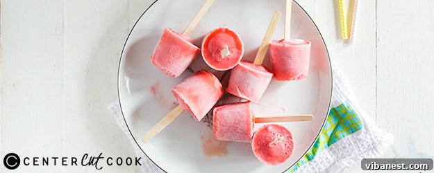 Vibrant homemade strawberry lemonade ice pops, a refreshing summer dessert ready to cool you down