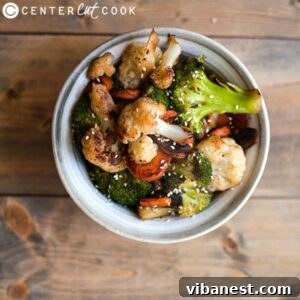 Pan-Seared Garden Medley 2 Sautéed Vegetables served in a white bowl, garnished with sesame seeds, ready to be enjoyed.