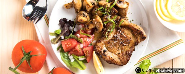 Crispy Skinned Lemon Pepper Chicken on a serving plate, vibrant and appetizing