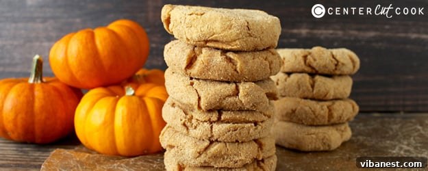Autumn Spice Pumpkin Cheesecake Cookies 3 Close-up of a stack of Pumpkin Cheesecake Cookies, showing the soft interior and graham cracker coating.