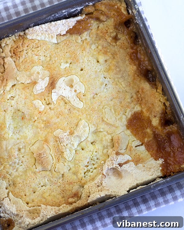 Golden Pear Dump Cake 3 Overhead shot of pear dump cake made in an 8x8 baking dish, ready to be served.