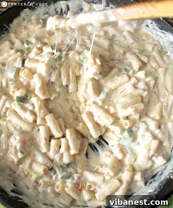 jalapeno-popper-mac-and-cheese-3.jpg Close-up of fresh ingredients for Jalapeño Popper Mac and Cheese, including jalapeños, onion, and various cheeses.