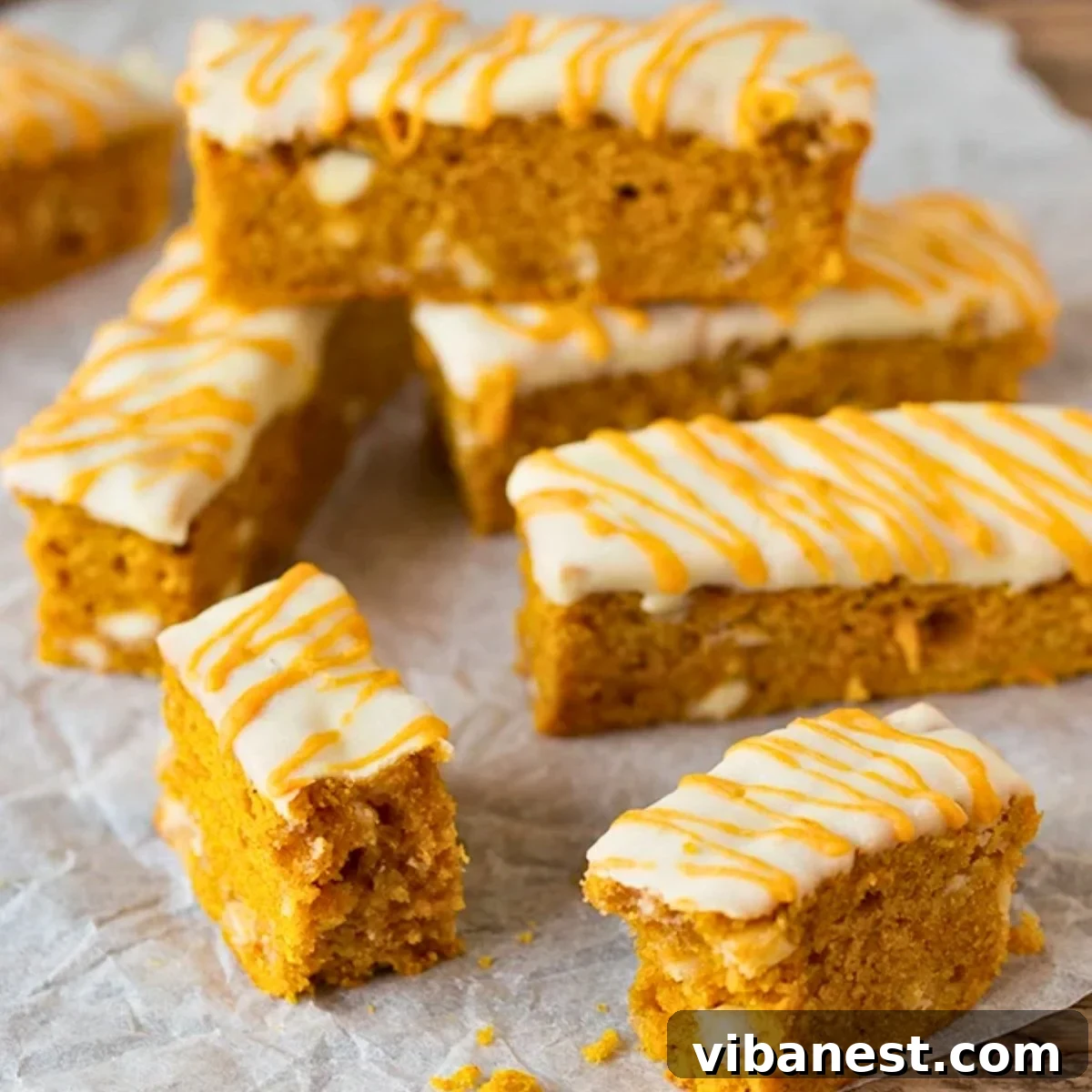 Pumpkin Spice Blondie Sticks 2 Delicious pumpkin blondie fingers topped with white chocolate drizzle, perfect for fall