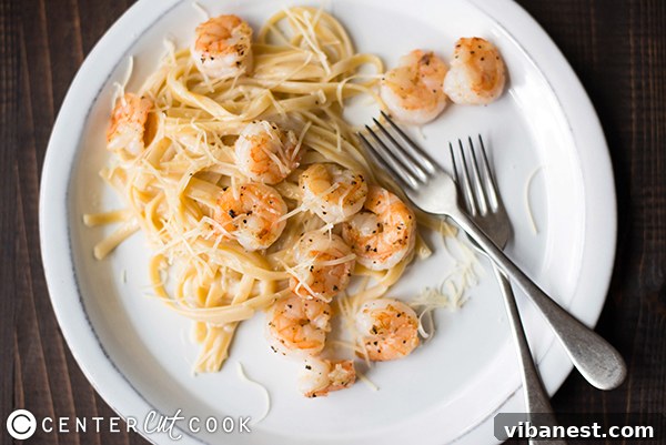 shrimp-fetuccine-alfredo-2.jpg Close-up of freshly cooked shrimp being added to a pan