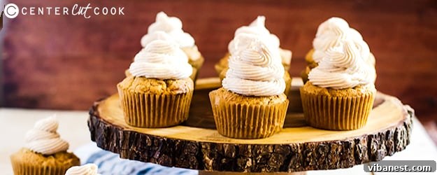 Delicious pumpkin spice cupcakes with cinnamon cream cheese frosting, garnished with cinnamon