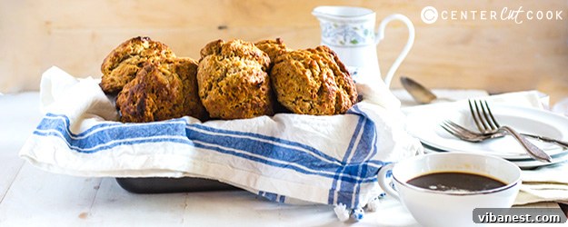Golden brown cinnamon honey drop biscuits on a baking sheet, ready to serve.