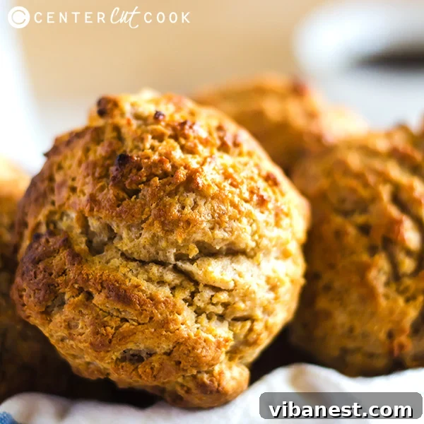 A serving of freshly baked cinnamon honey drop biscuits on a rustic plate, ready to be enjoyed with a cup of coffee.