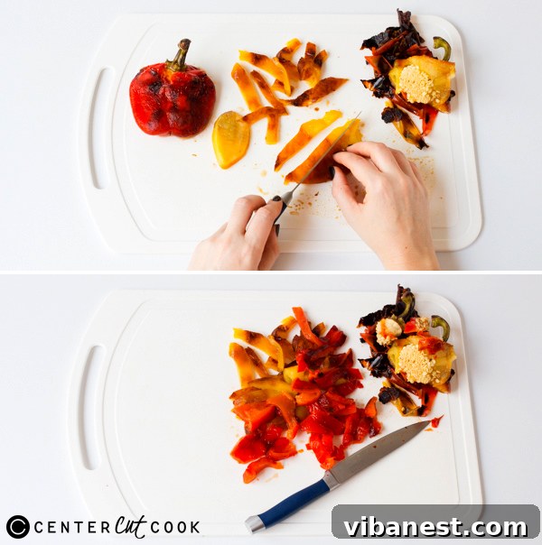 Peeling Roasted Bell Pepper Skin A hand gently peeling the charred skin off a roasted bell pepper