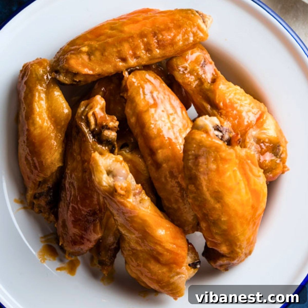Oven-Crisped Buffalo Wings 2 crispy baked buffalo wings fresh out of the oven, coated in buffalo sauce, served with ranch