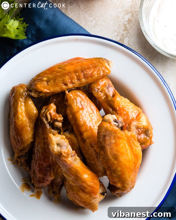 baked-buffalo-wings-2.jpg baked buffalo wings coated in sauce