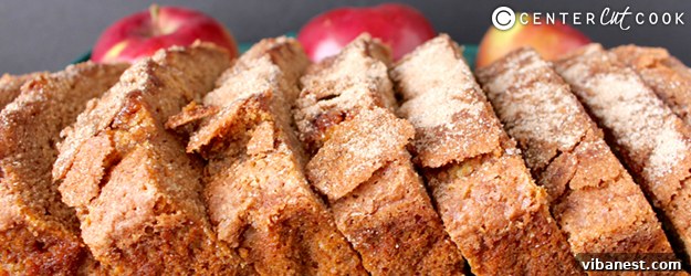 Delicious loaf of Cinnamon Apple Bread, freshly baked and golden brown, ready to be sliced