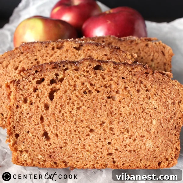 Cinnamon Apple Bread Cooling Warm Cinnamon Apple Bread cooling on a wire rack, steam gently rising, highlighting its fresh-baked appeal