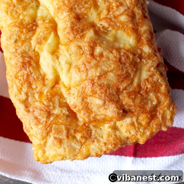 quick-garlic-cheesy-bread.jpg Irresistible golden-brown Garlic Cheesy Bread, fresh from the oven, ready to be sliced and enjoyed.