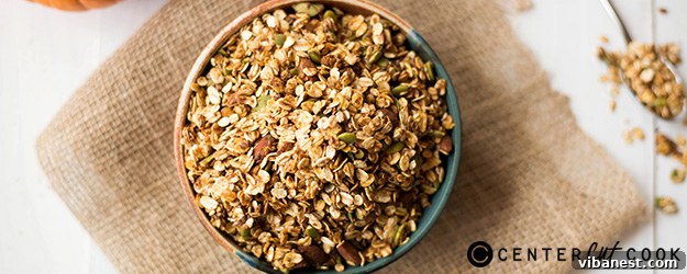 Delicious homemade pumpkin spice granola scattered on a surface, close-up shot