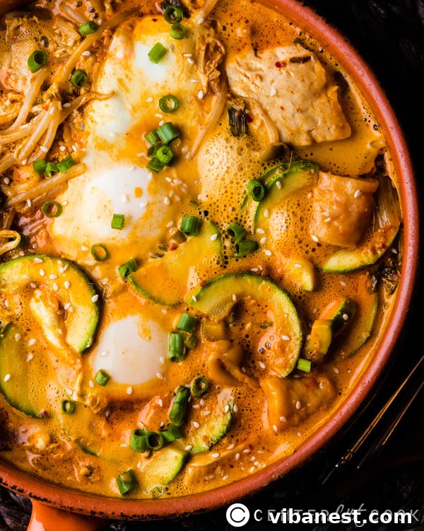 Sundubu Jjigae - Rich and Satisfying Flavor Close-up of freshly made Korean Tofu Stew with soft tofu, green onions, and savory broth