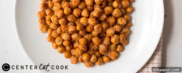 Golden crispy roasted chickpeas cooling on a baking sheet