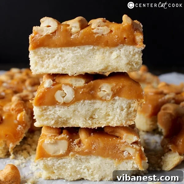 Stacked Caramel Cashew Bars Finished Caramel Cashew Bars stacked on a plate, ready to be served
