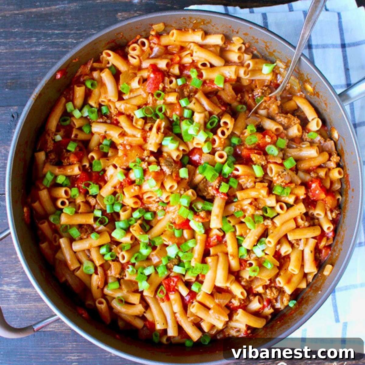 Easy Weeknight American Goulash 4 overhead photo of easy one-pot American goulash garnished with green onion, ready to be served