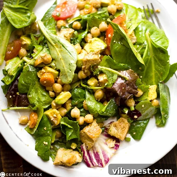 Plated Balsamic Chicken Salad with dressing drizzled, ready to serve