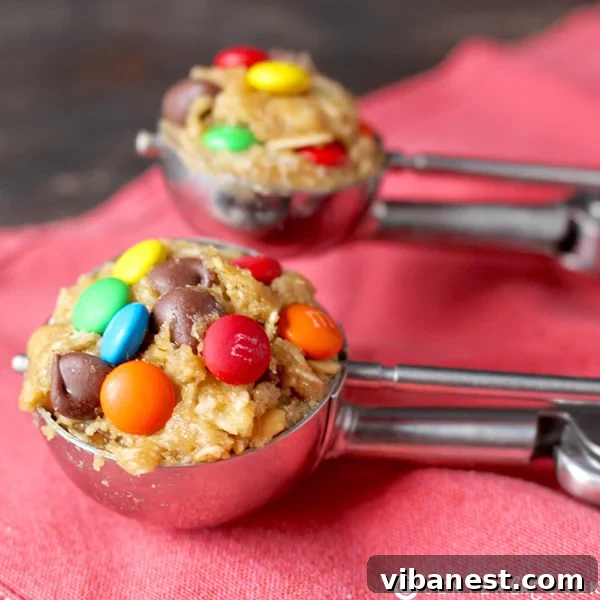 cookie_baking_tips_cookiescoop.jpg A stainless steel cookie scoop resting in a bowl of chocolate chip cookie dough, ready to portion out perfect, uniform cookies.