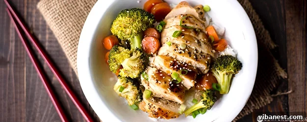 Delicious homemade chicken teriyaki bowls with fresh vegetables and rice, a perfect weeknight meal