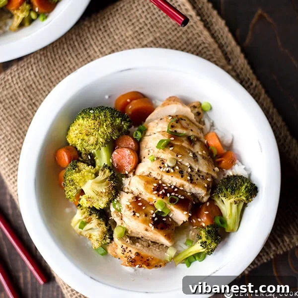 Chicken Teriyaki Skillet Preparation Cooked chicken teriyaki with sauce, vibrant broccoli florets, and carrot slices simmering in an oven-safe skillet, ready for serving