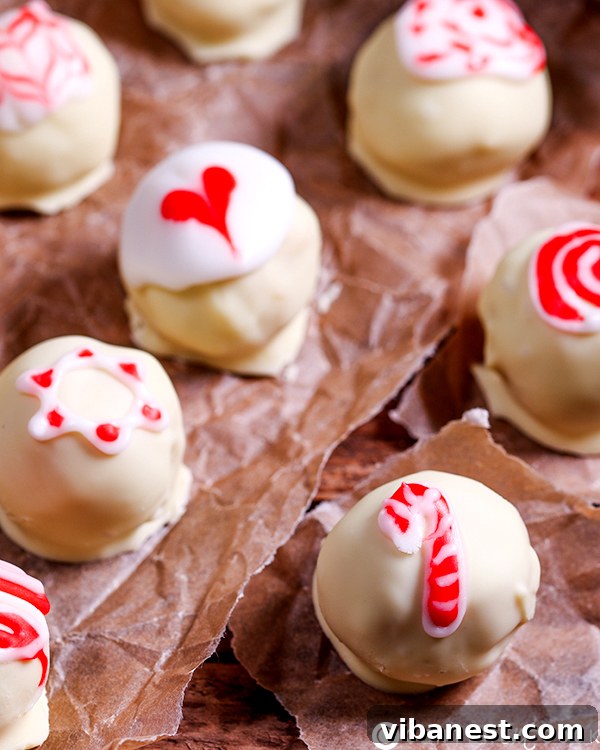 candy-cane-truffles-3.jpg Decorated candy cane truffles with festive icing swirls