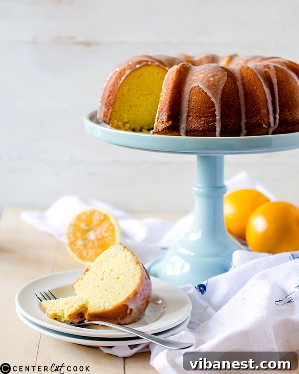 Meyer Lemon Pound Cake Slice Close-up slice of Iced Meyer Lemon Pound Cake on a wooden board