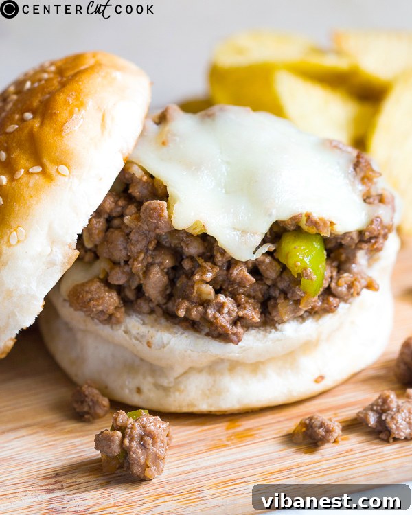 Philly Cheesesteak Sloppy Joes Ready to Serve Close-up of a serving of Philly Cheesesteak Sloppy Joes, showcasing the cheesy topping