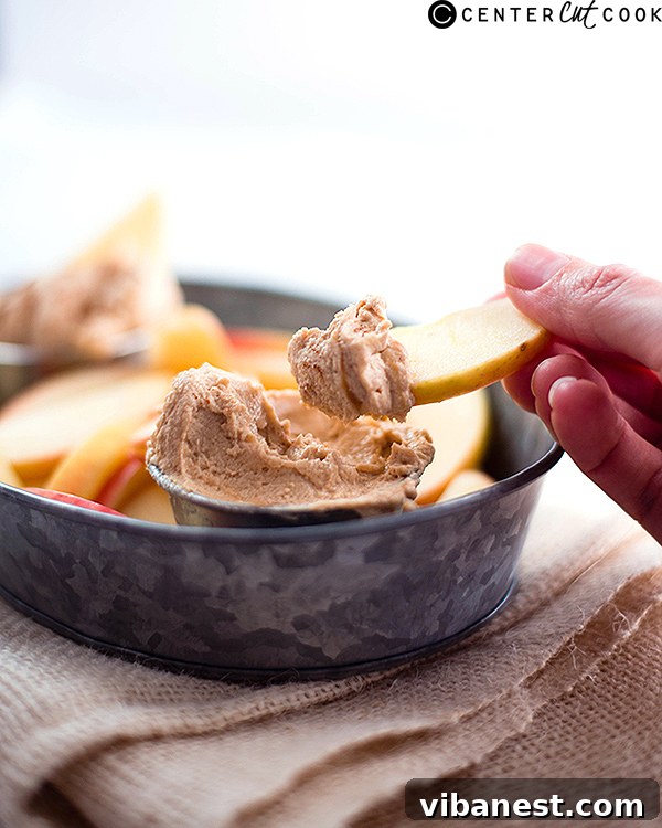 Smooth Peanut Butter Fruit Dip Texture Close-up photo of a bowl filled with smooth, creamy peanut butter fruit dip