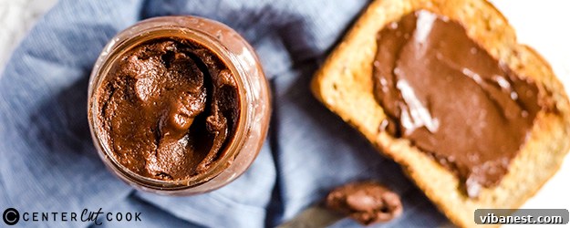 Homemade Nutella spread on toast, a close-up shot showing its creamy texture and rich color.