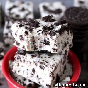 Oreo Cheesecake Fudge squares arranged on a plate